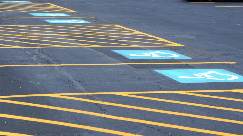 A parking lot with blue and white stripes.