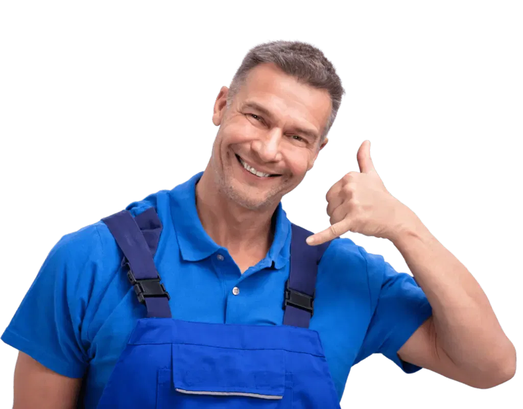 A man in overalls giving the thumbs up sign.
