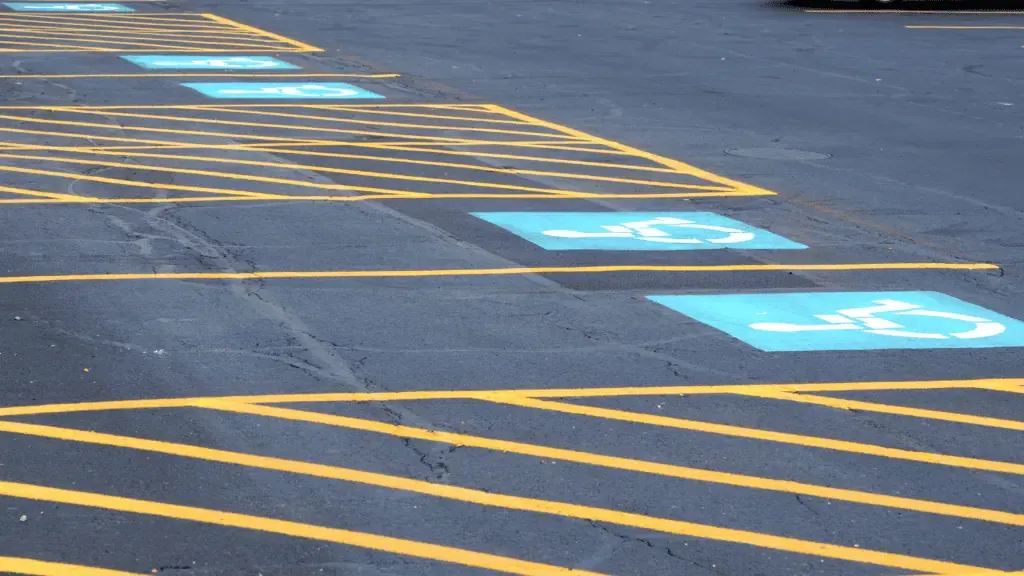 A parking lot with blue and white stripes.